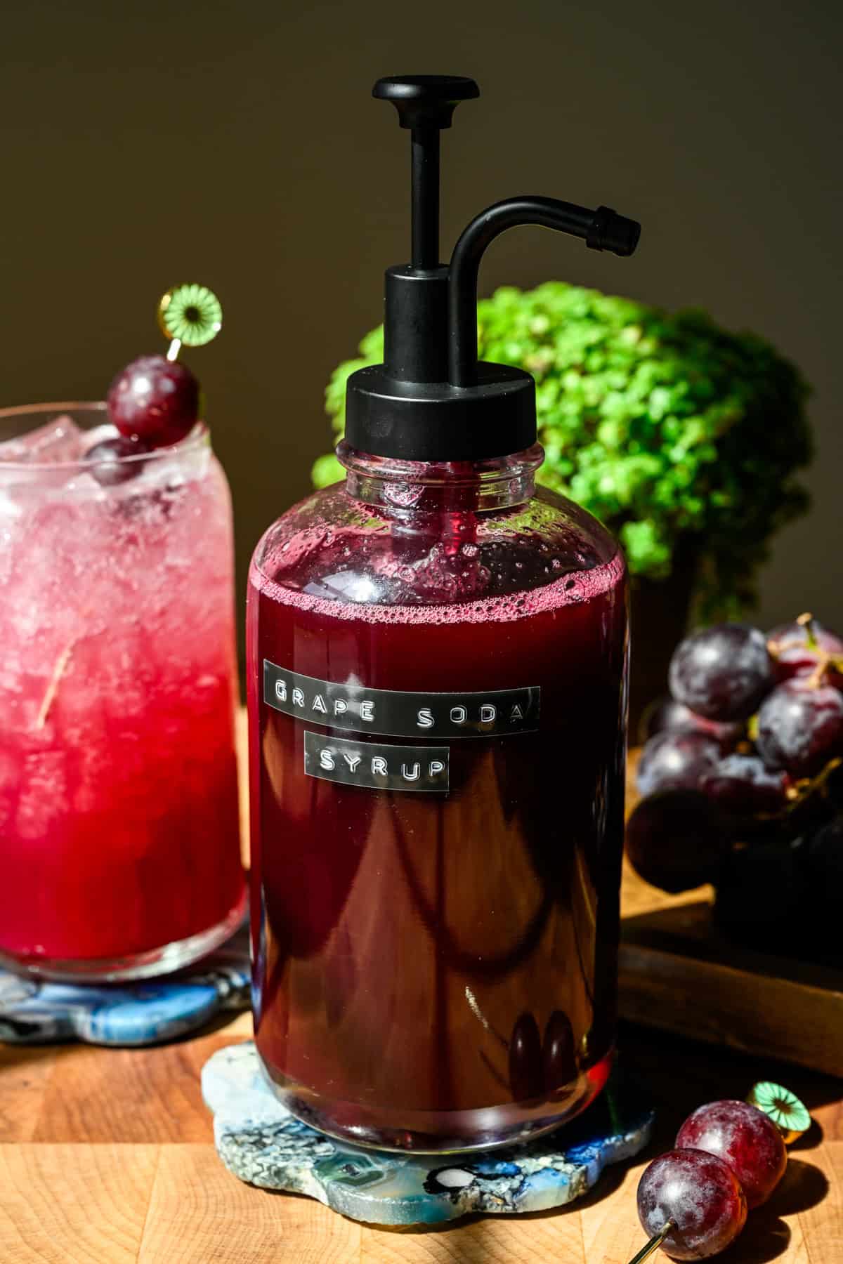 Front view of grape soda syrup in a bottle.
