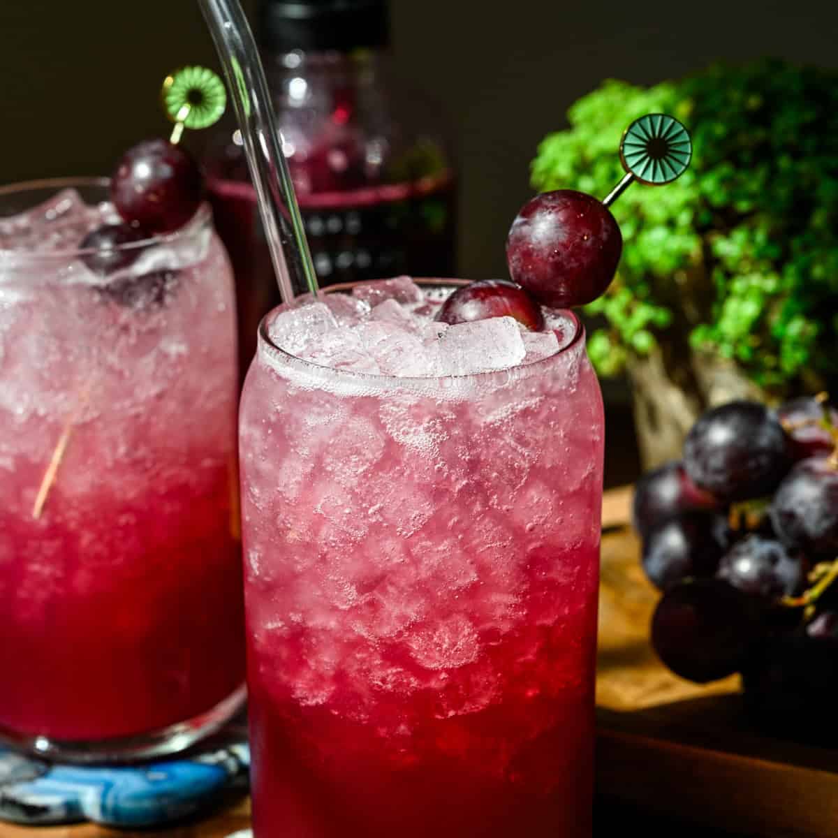 Front view of grape soda in a glass.