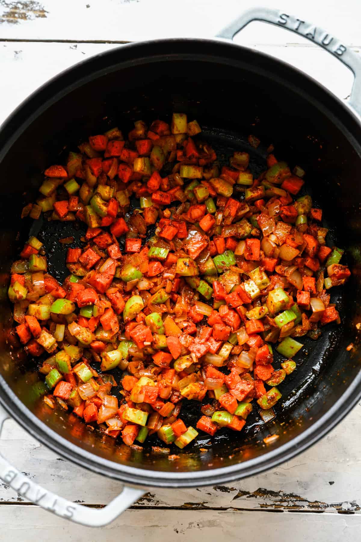 Veggies sautéed in a large pot.