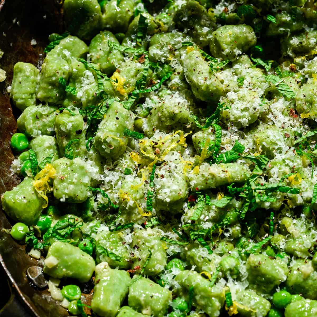 Overhead view of gnocchi in a pan.