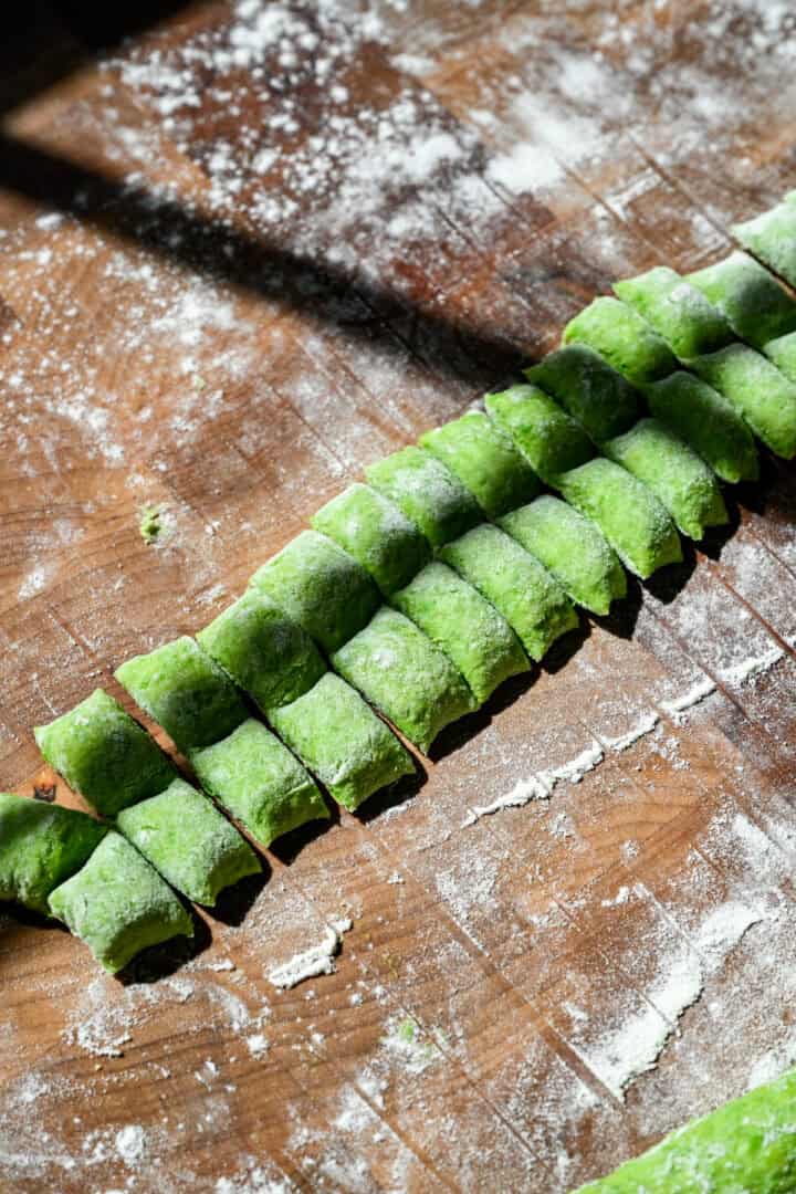 Overhead view of gnocchi sliced into pieces.