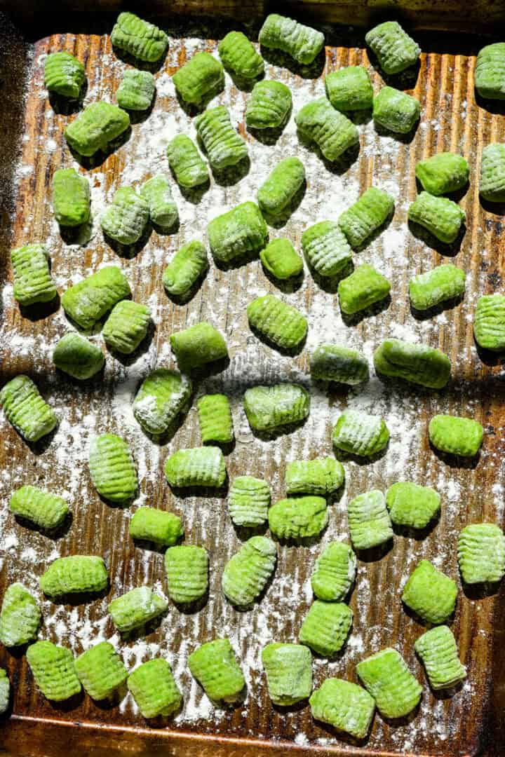 Gnocchi after being rolled on a gnocchi board.