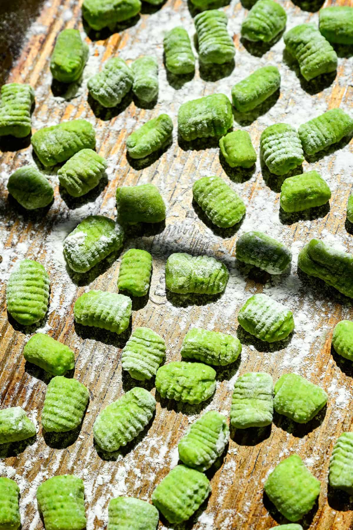 Gnocchi after being rolled on a gnocchi board.