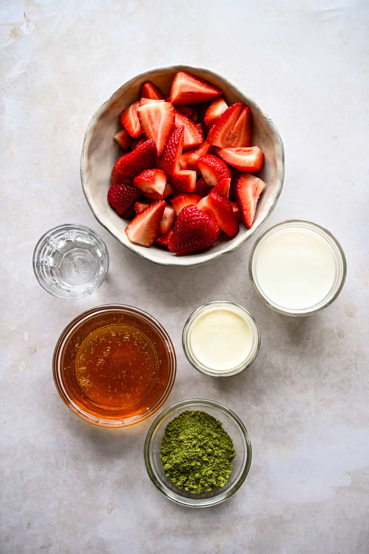 Overhead view of ingredients needed to make strawberry cold foam.