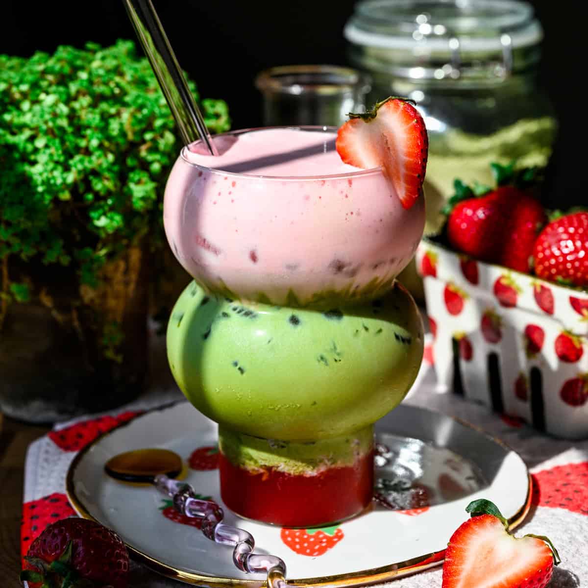 Iced strawberry matcha latte topped with strawberry cold foam.