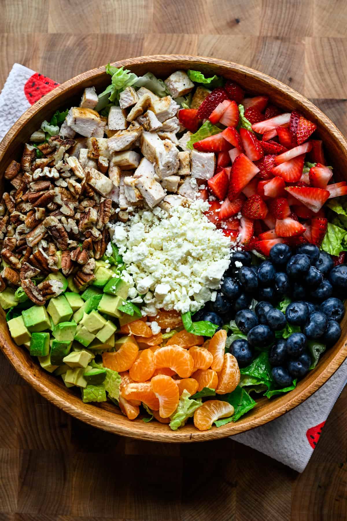 Overhead view of strawberry poppyseed salad in. a bowl.