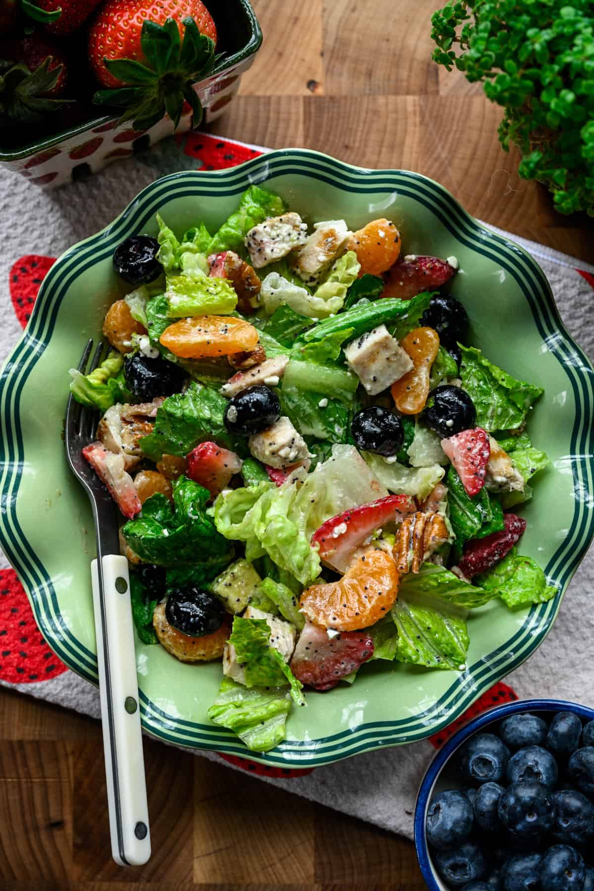 Overhead view of strawberry salad in a bowl.