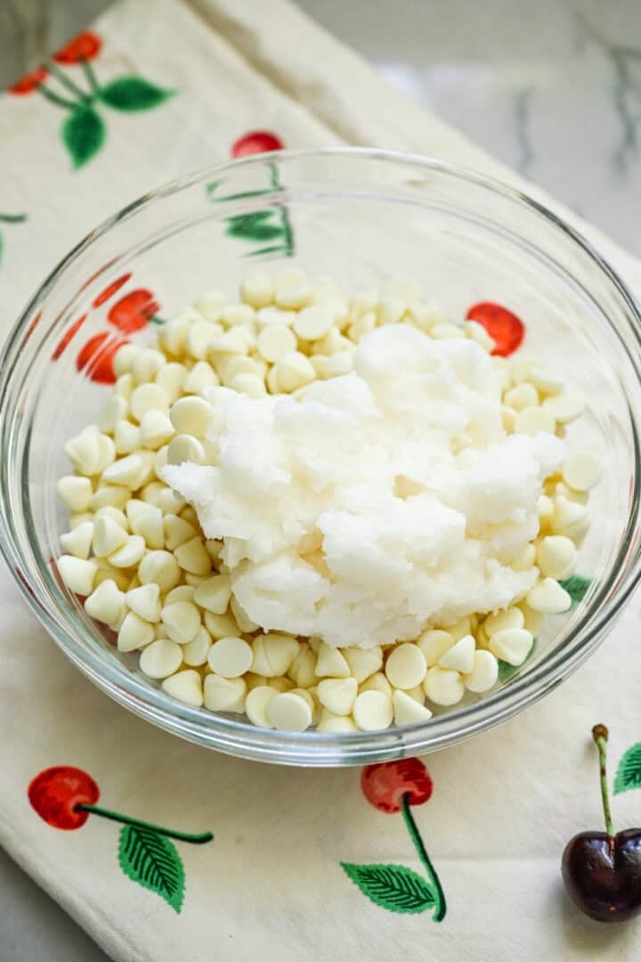 white chocolate chips and coconut oil in a bowl before melting.