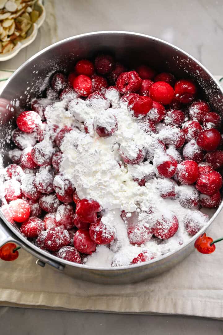 frozen tart cherries in a pot with sugar, cornstarch and lemon juice.