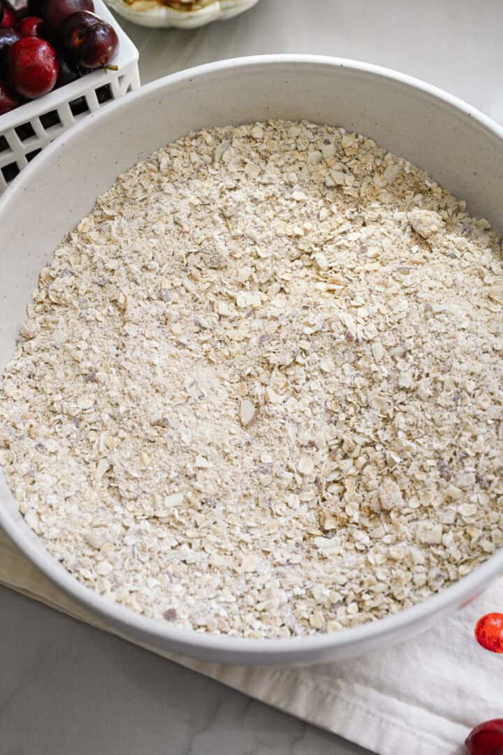 dry ingredients for crumble topping mixed together in a bowl.