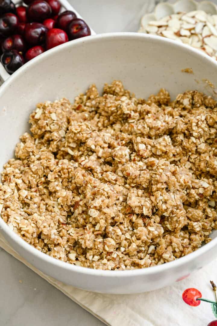 cherry pie bar crust/topping mixed together in a bowl.