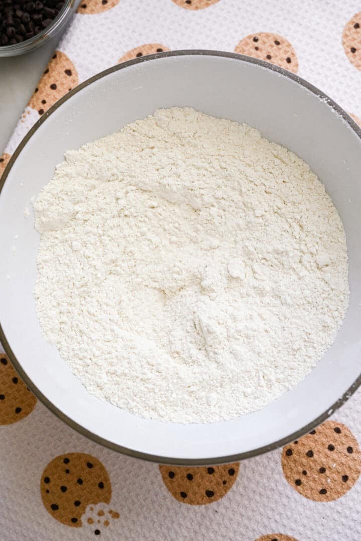 Overhead view of flour in a bowl.