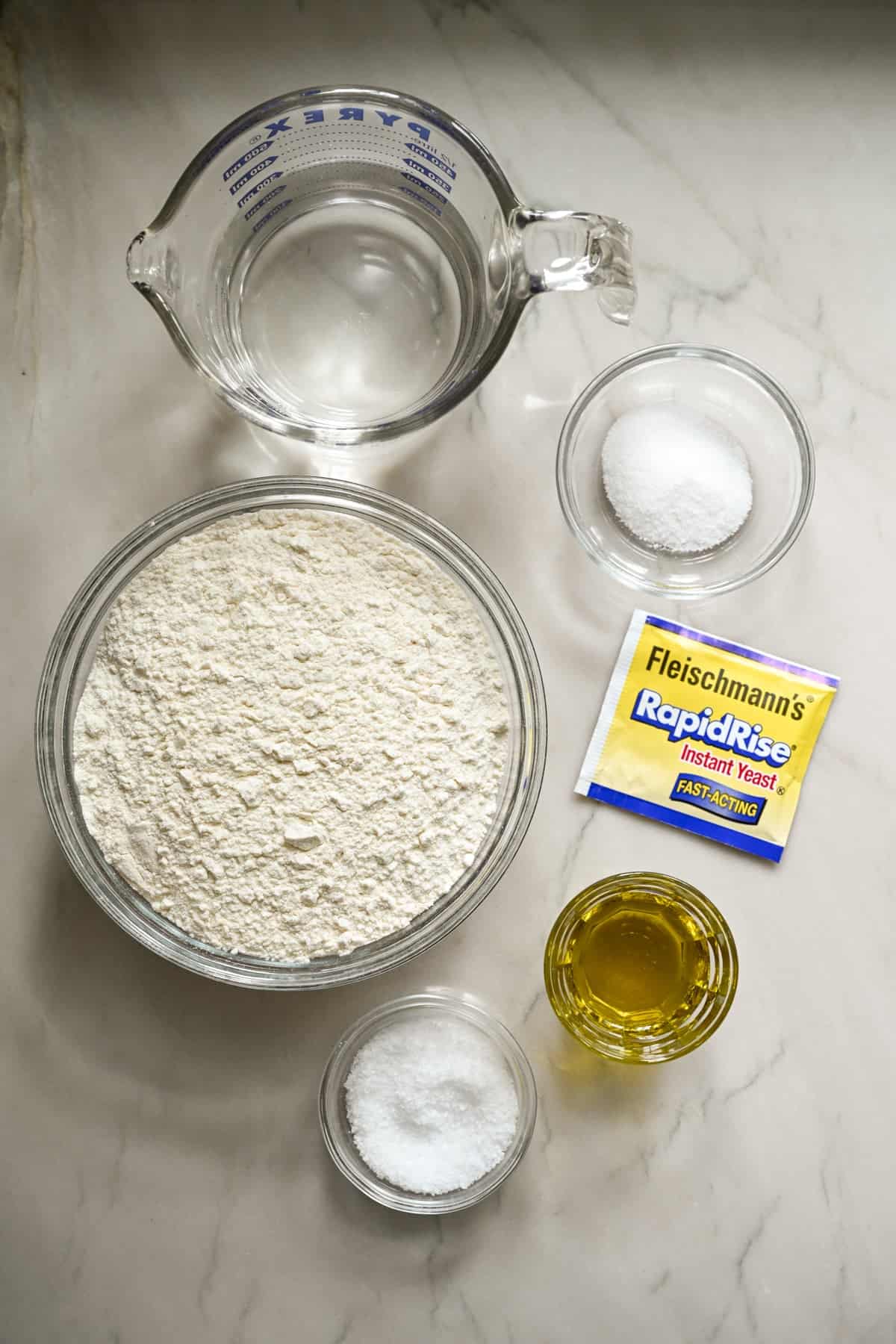 Overhead view of ingredients needed for homemade focaccia recipe.