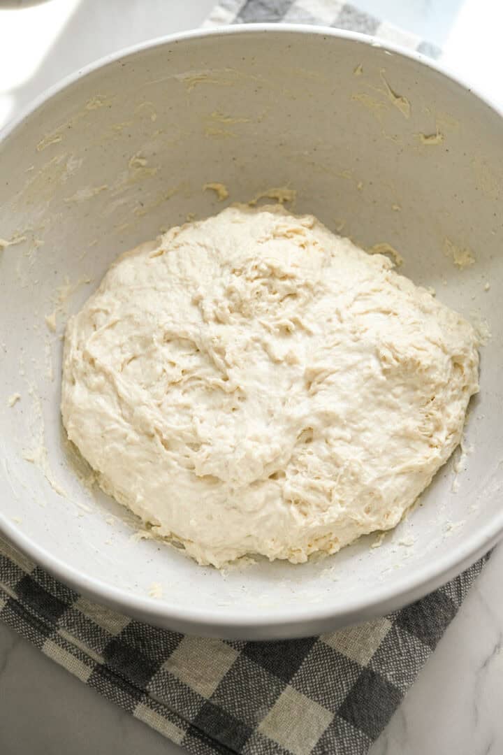 Focaccia dough mixed together in a bowl before rising.