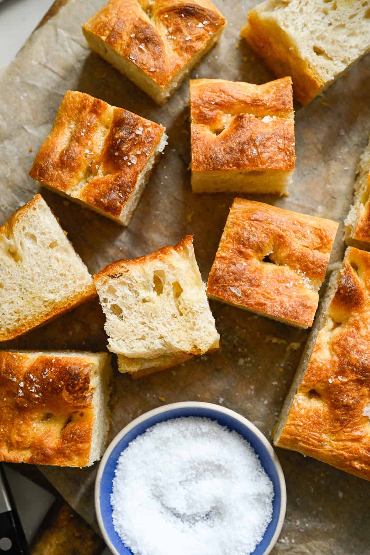 Close up overhead view of several slices of homemade focaccia bread.