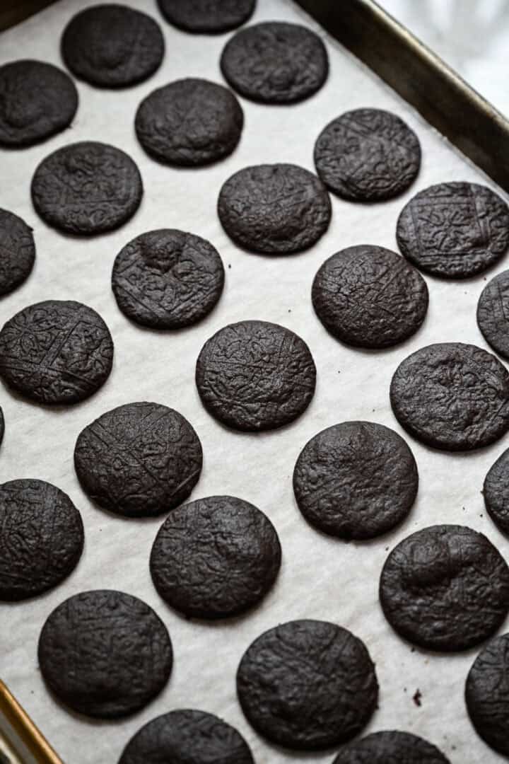 homemade oreo cookies on baking sheet after baking.