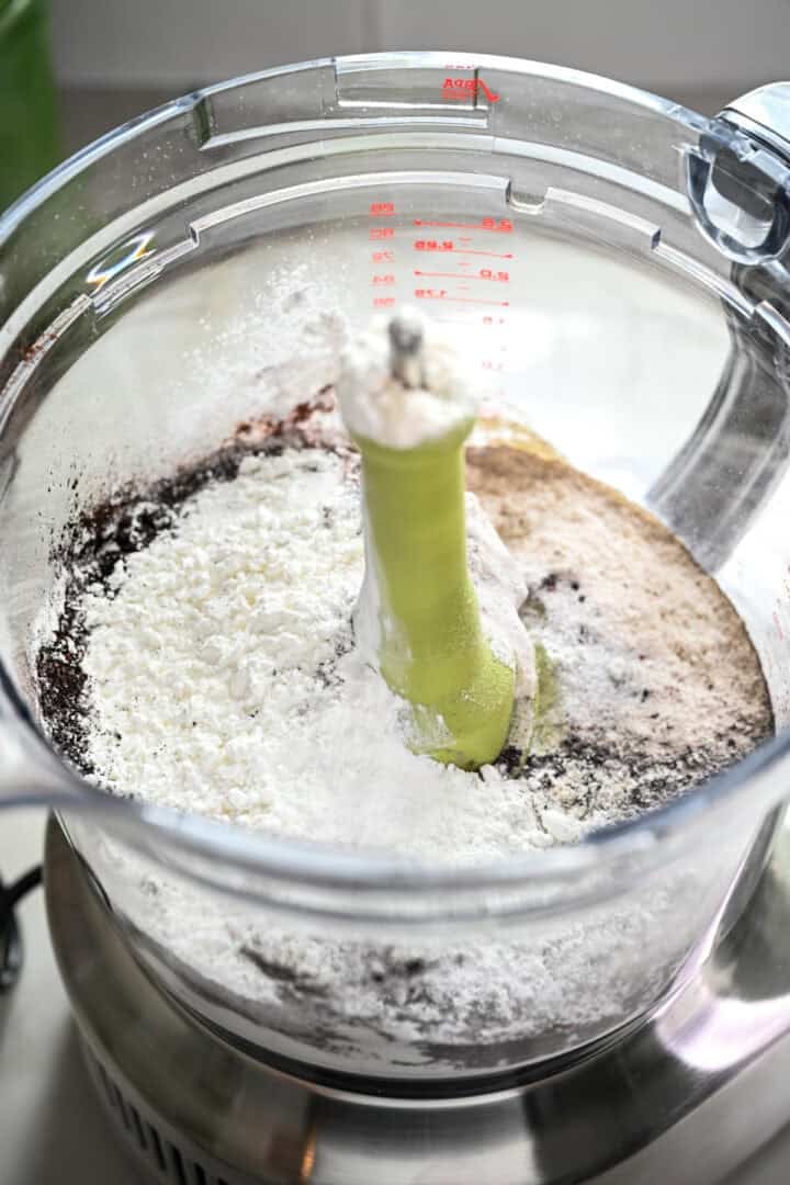Dry ingredients for oreo cookie dough in food processor before mixing.
