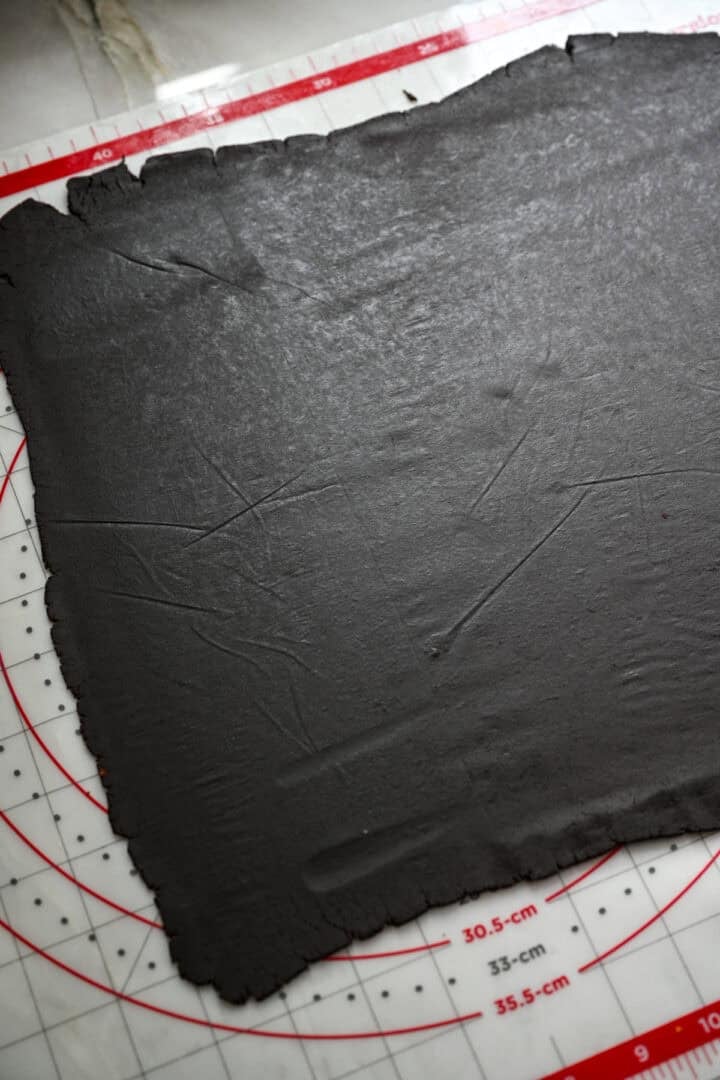 Oreo cookie dough rolled out into a thin rectangle.