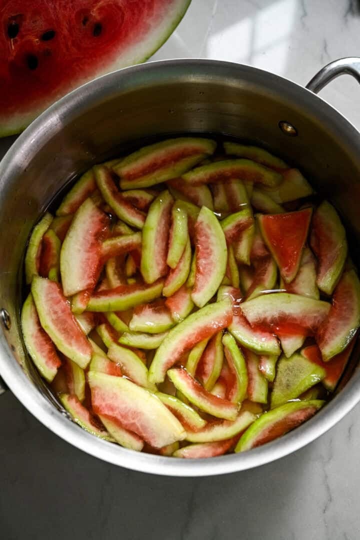 Watermelon rinds added to a pot.