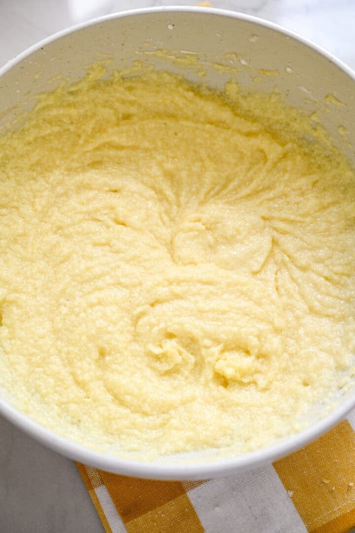 Wet ingredients mixed together in a white bowl for cake batter.