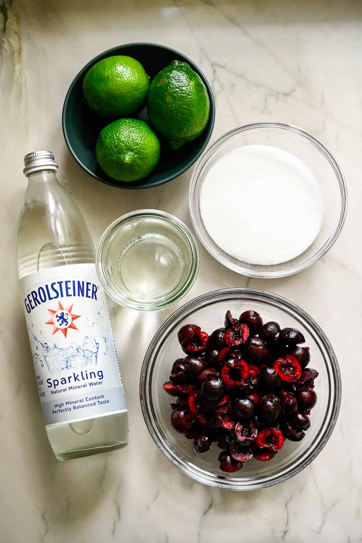 Overhead view of cherry lime soda ingredients.
