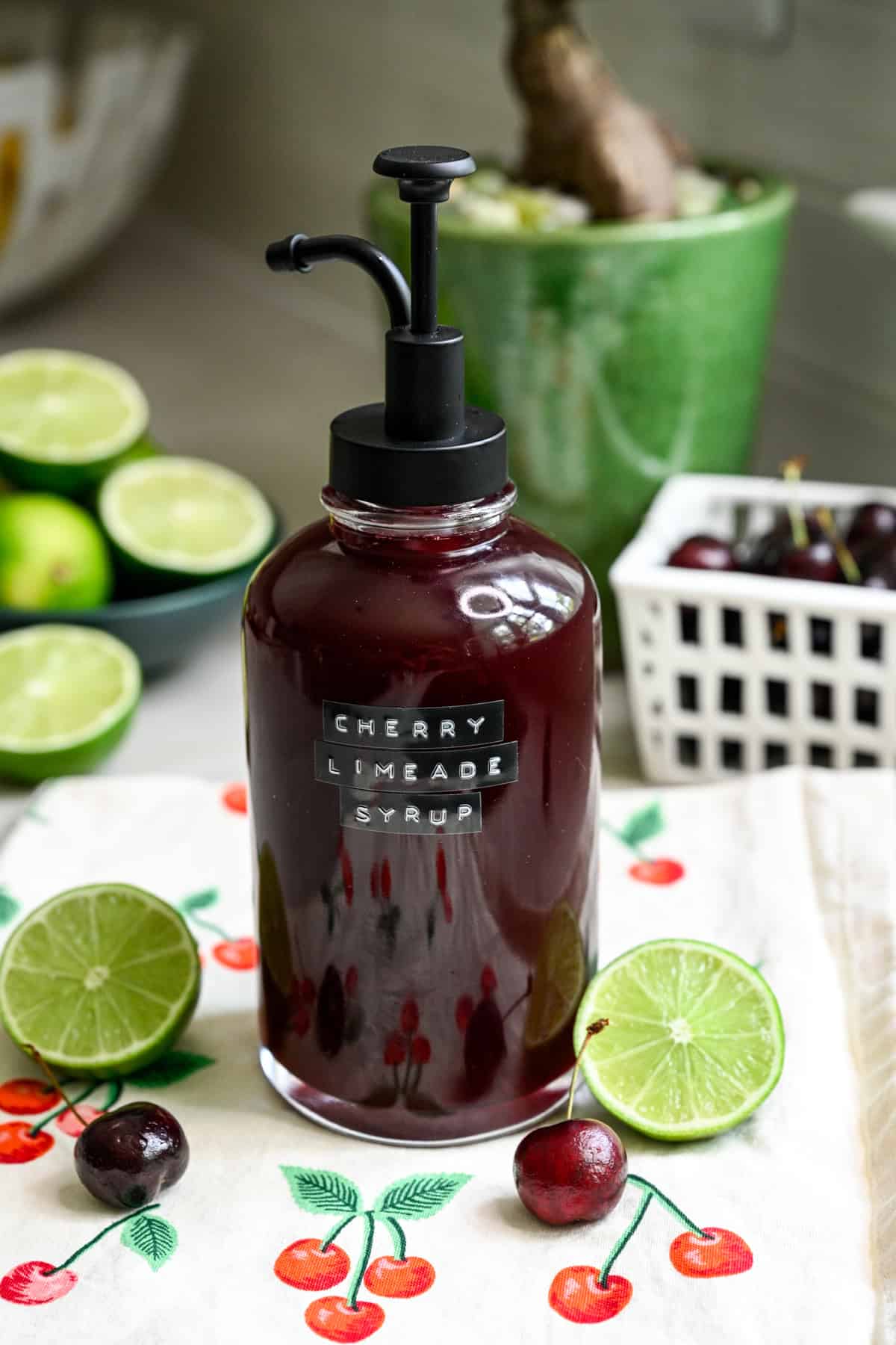 Front view of cherry lime soda in a pump dispenser.