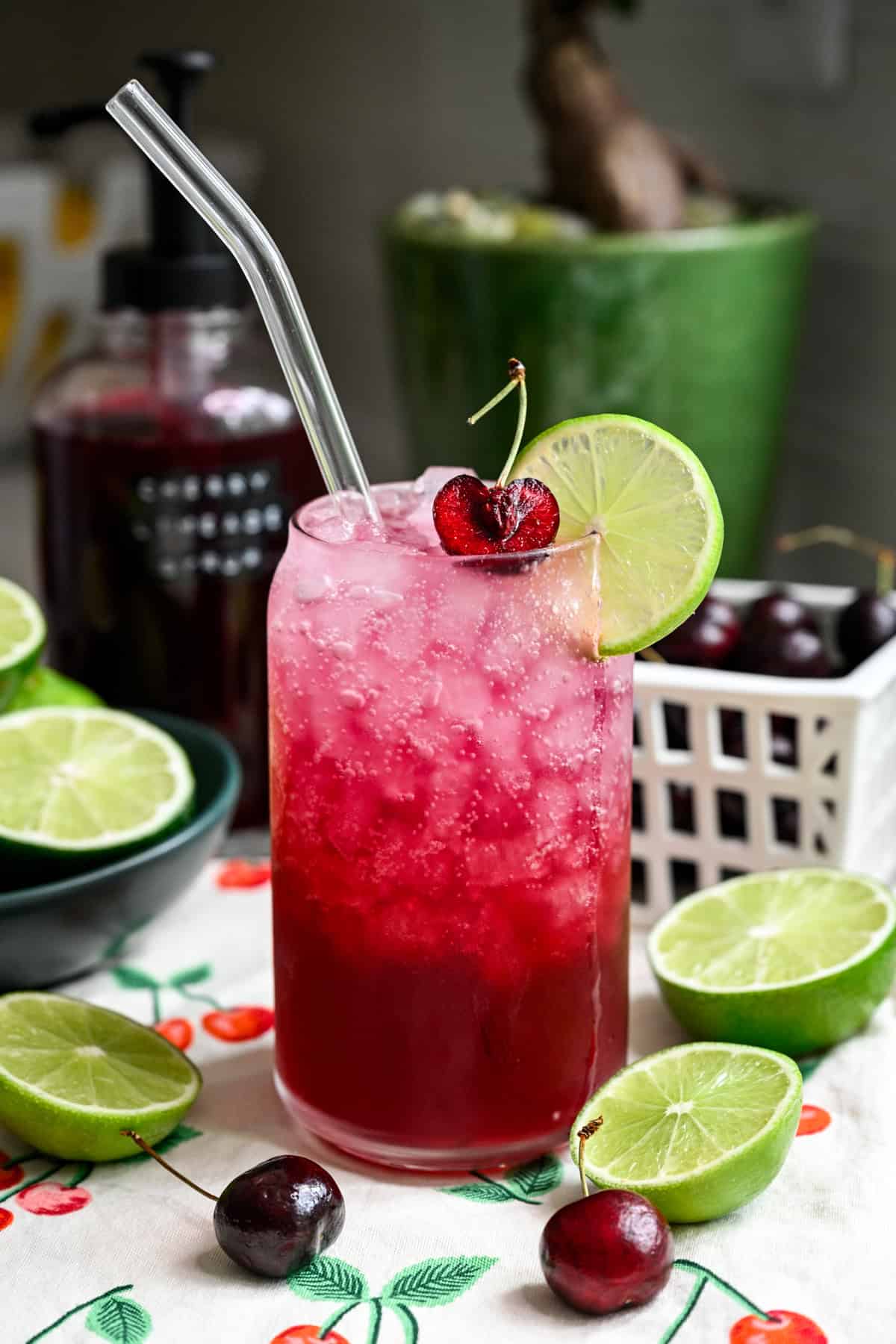 Front view of cherry lime soda in a glass.