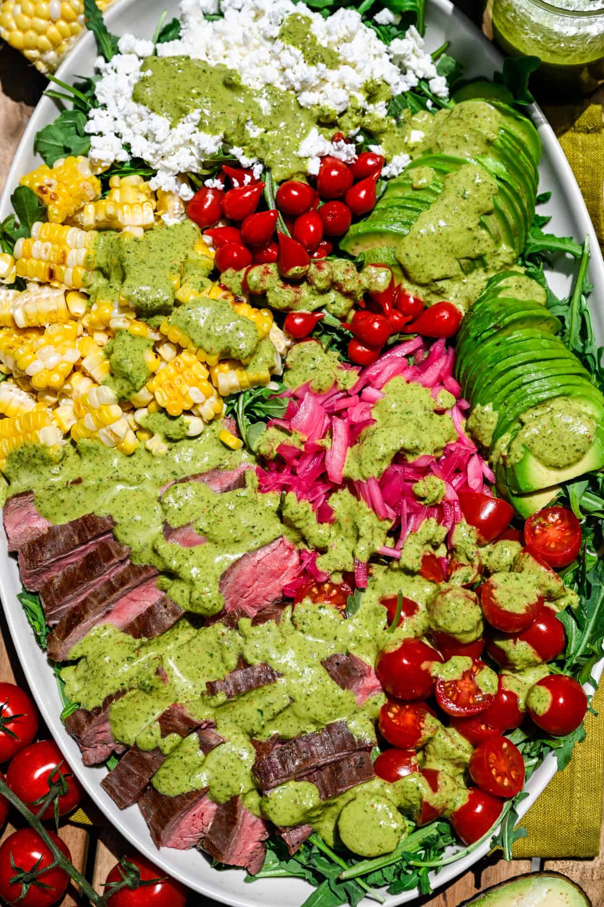 Overhead view of steak salad on a platter.