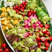 Overhead view of steak salad on a platter.