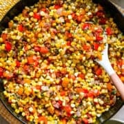 overhead view of confetti corn in a skillet.