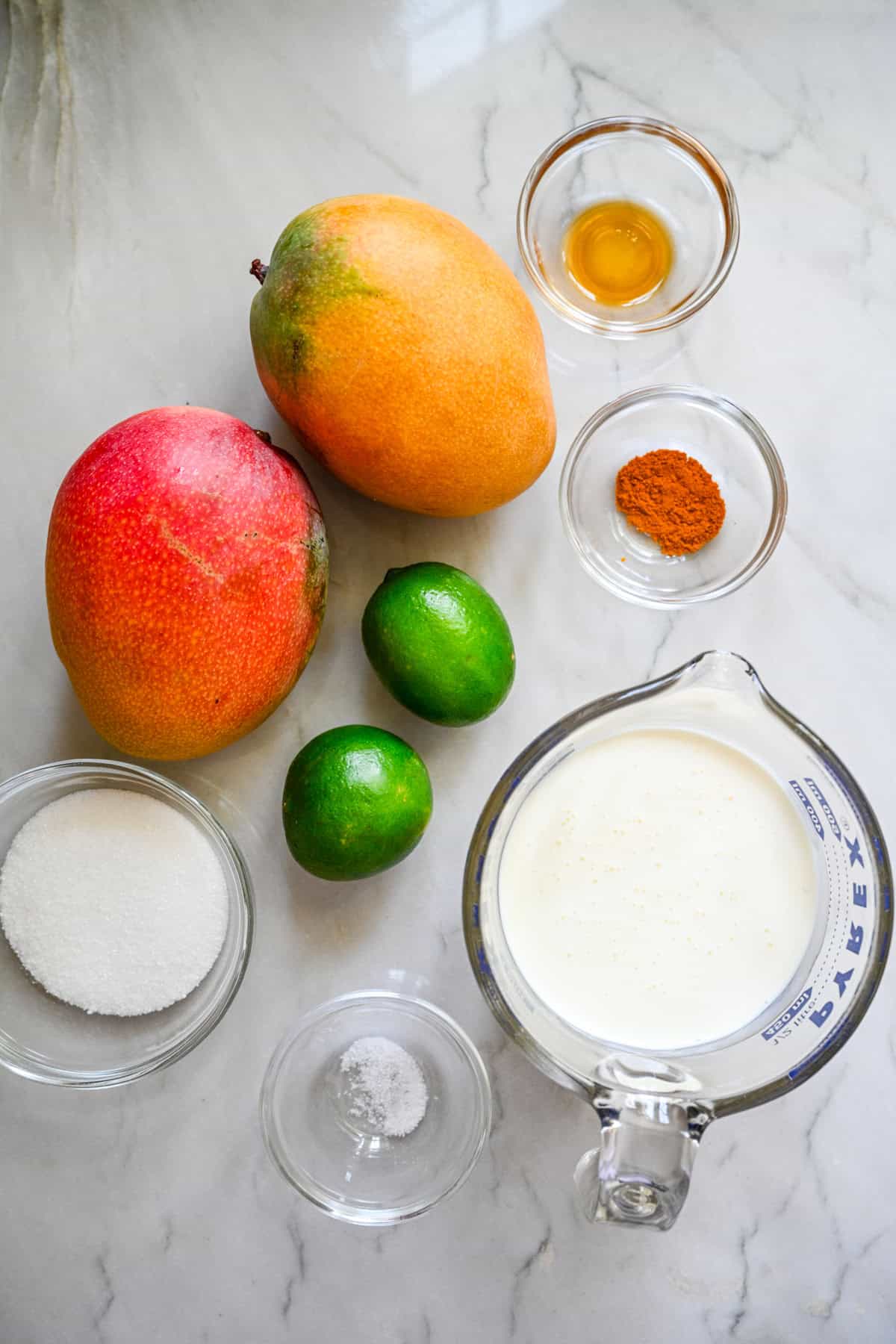 Overhead view of mango posset ingredients.