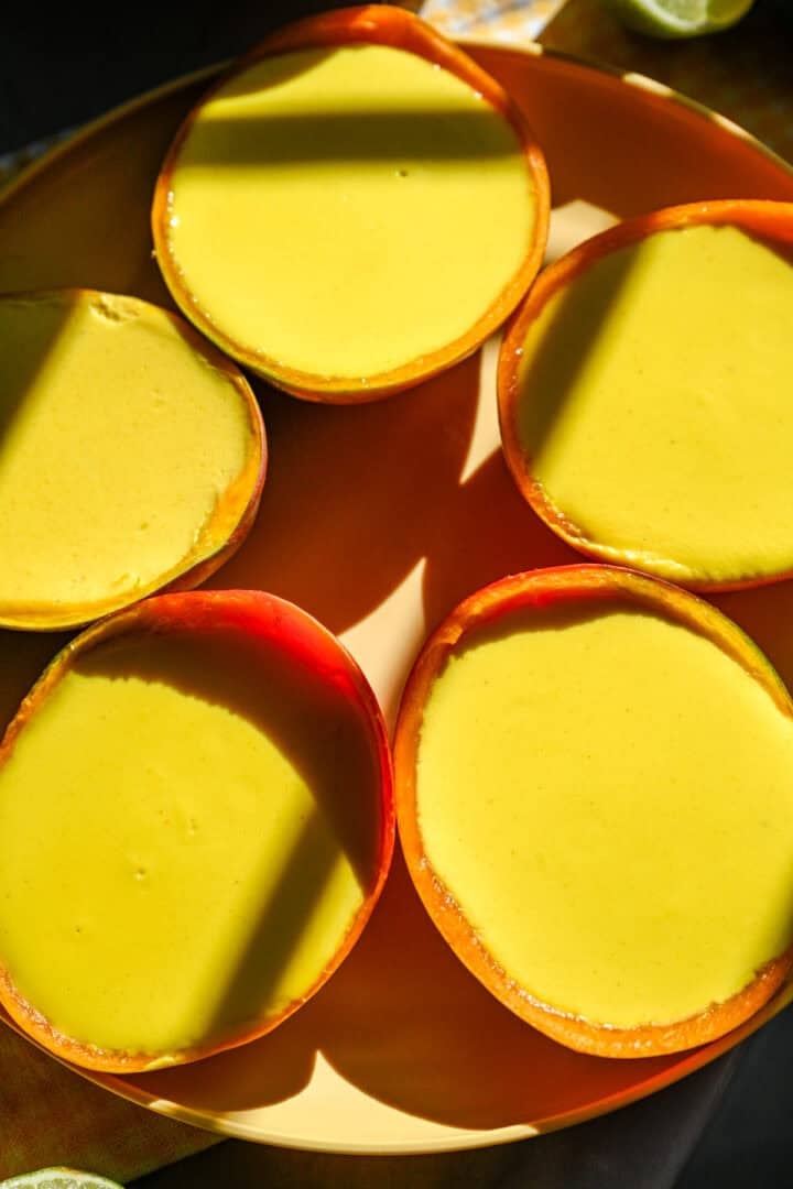 Overhead view of mango possets on a plate.