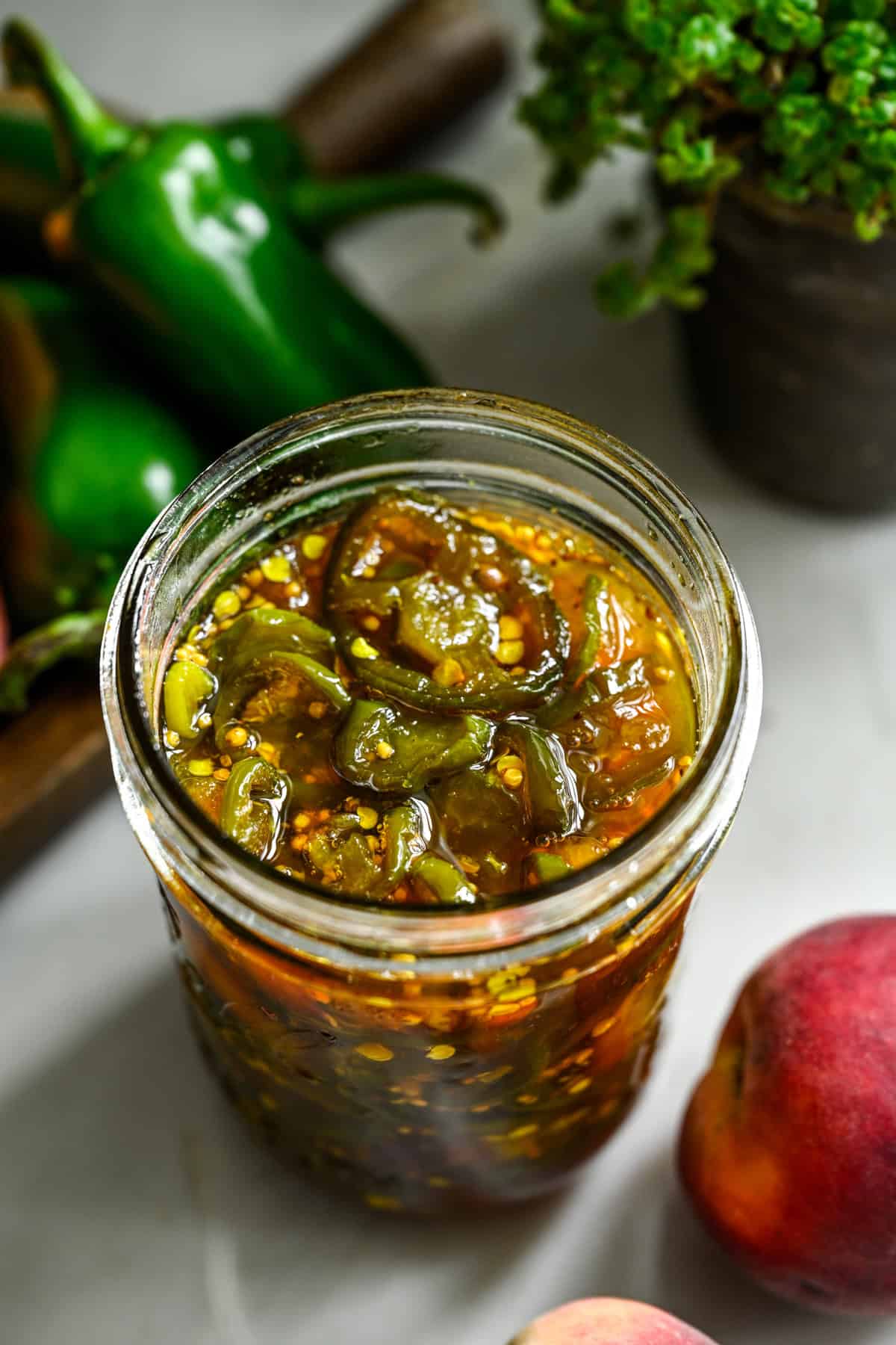 Overhead view of cowboy candy in a mason jar.