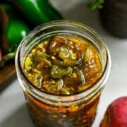 Overhead view of cowboy candy in a mason jar.
