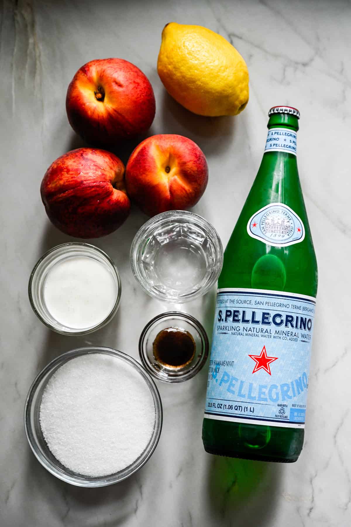 Overhead view of peach soda ingredients.
