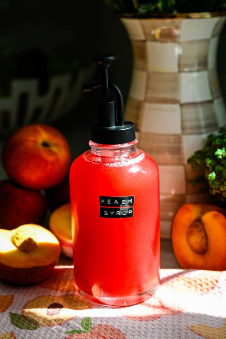 Peach syrup in a pump-style container.