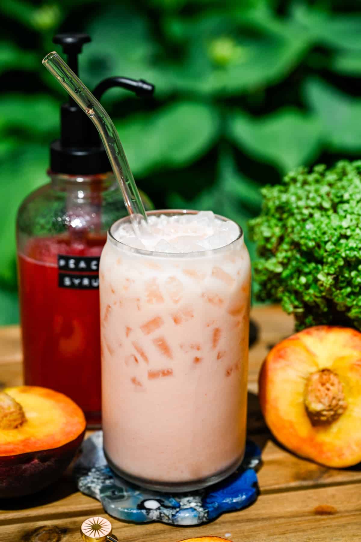 Front view of peach dirty soda after being stirred.