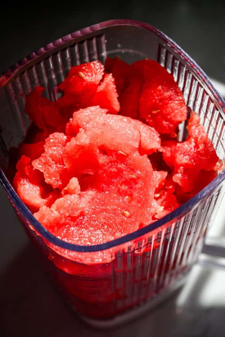 Overhead view of watermelon in a blender.