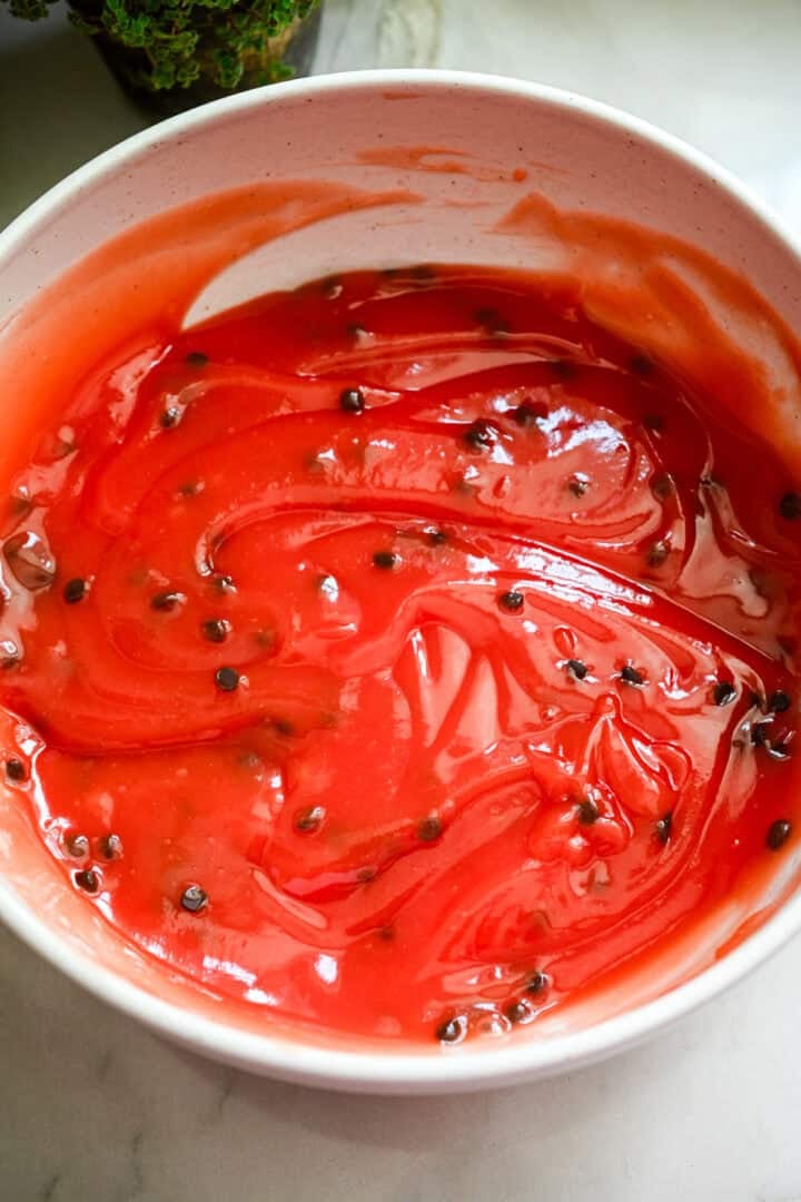 Overhead view of melon pudding with chocolate chips mixed in.