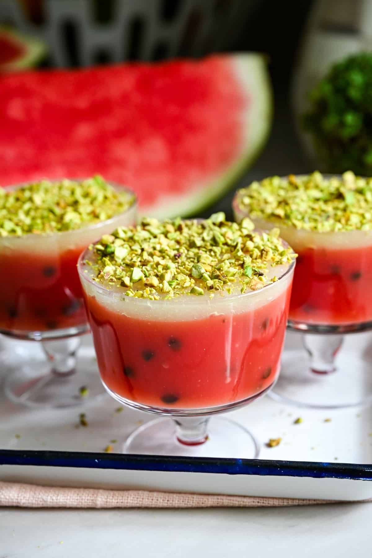 Front view of watermelon pudding in a dessert cup.