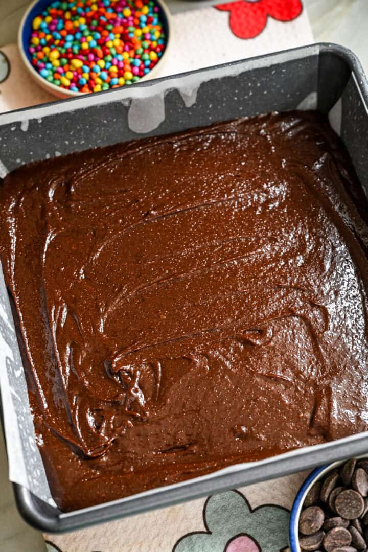 Brownie batter spread out in a pan.