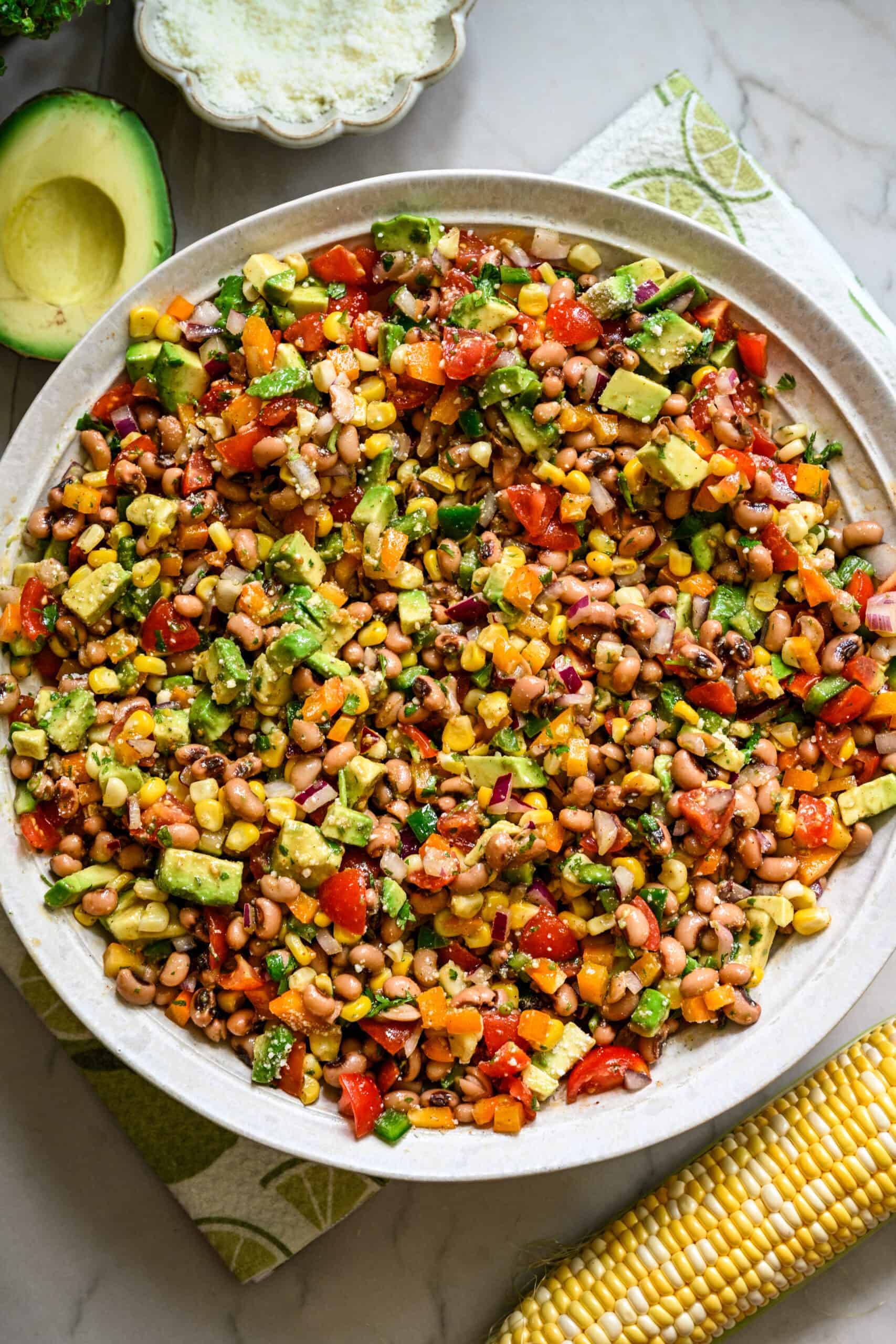 Overhead view of cowboy caviar salad in a big white salad bowl.