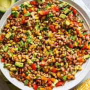 Overhead view of cowboy caviar salad in a big white salad bowl.