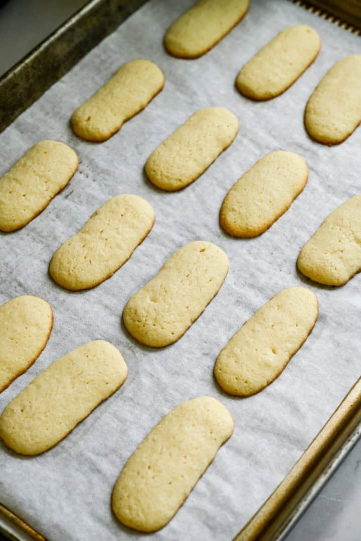 finished milano cookies on a baking sheet.