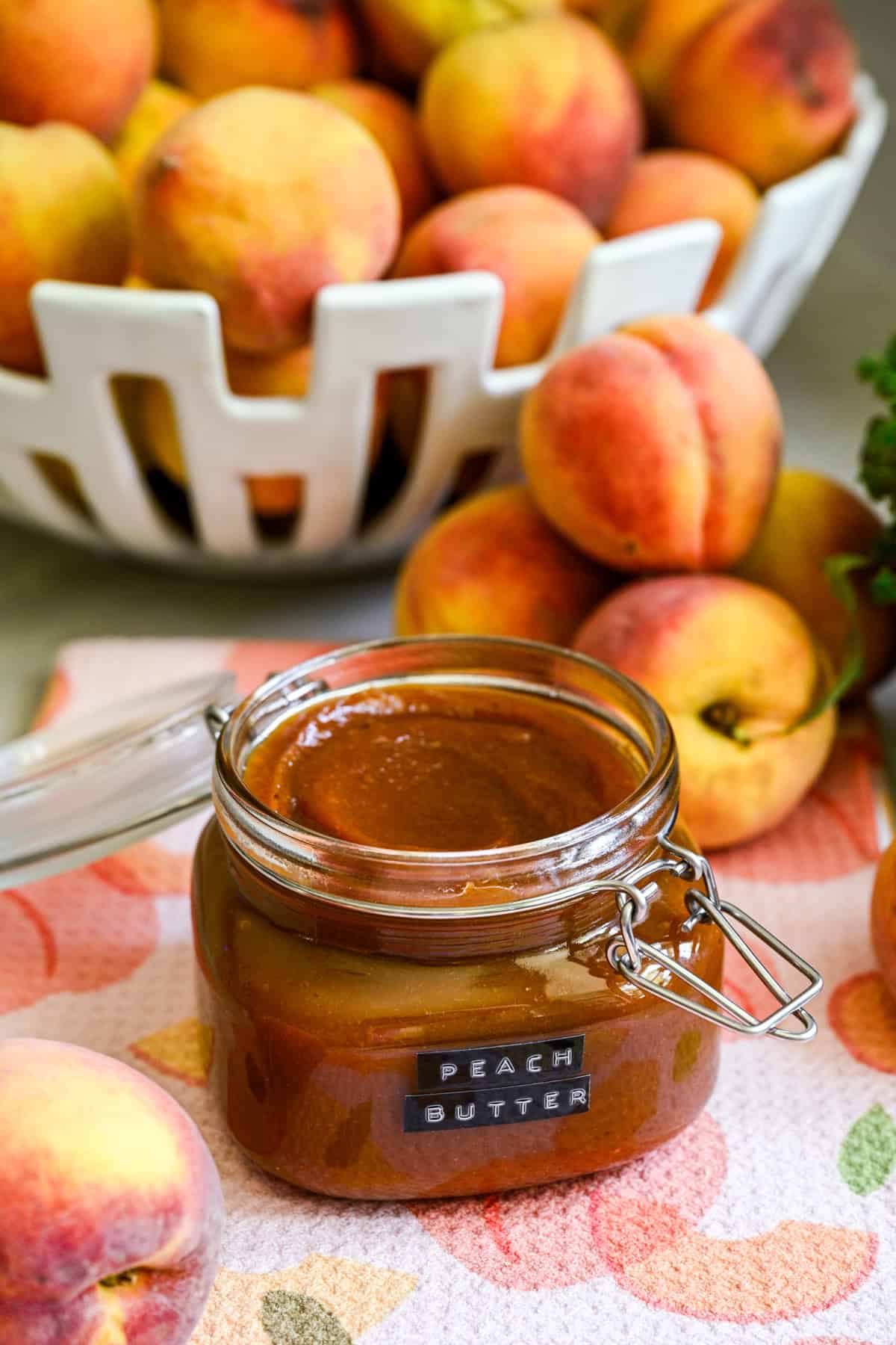 Peach butter in a swing top jar.
