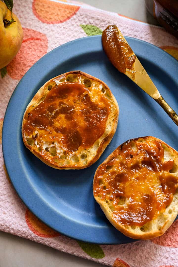 Peach butter on an english muffin.