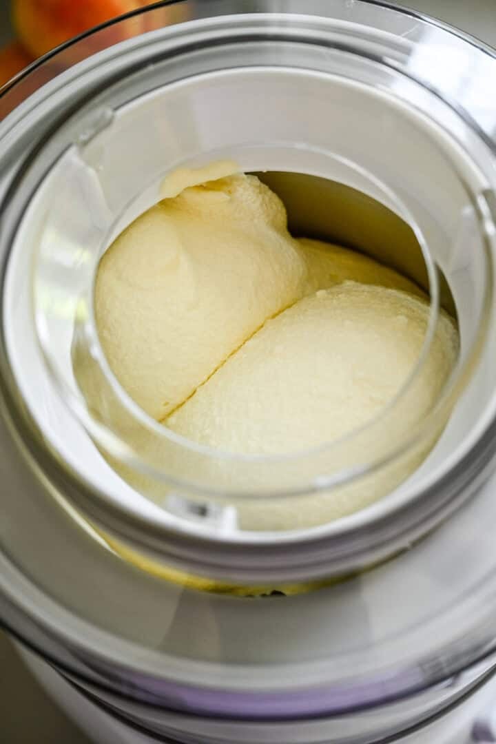 Overhead view of ice cream churning in an ice cream machine.