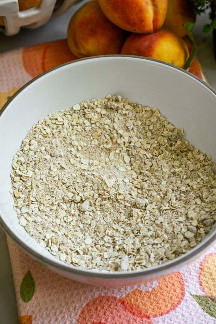 Overhead view of oats in a white bowl.