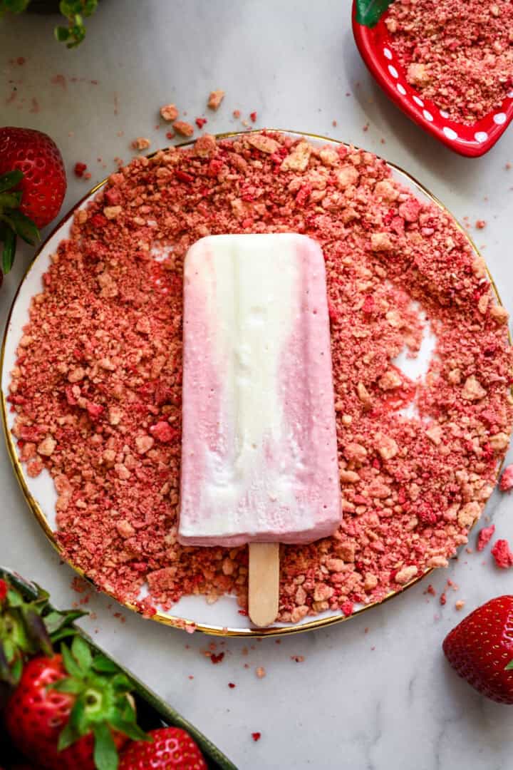 Before coating a popsicle in strawberry cookie coating.