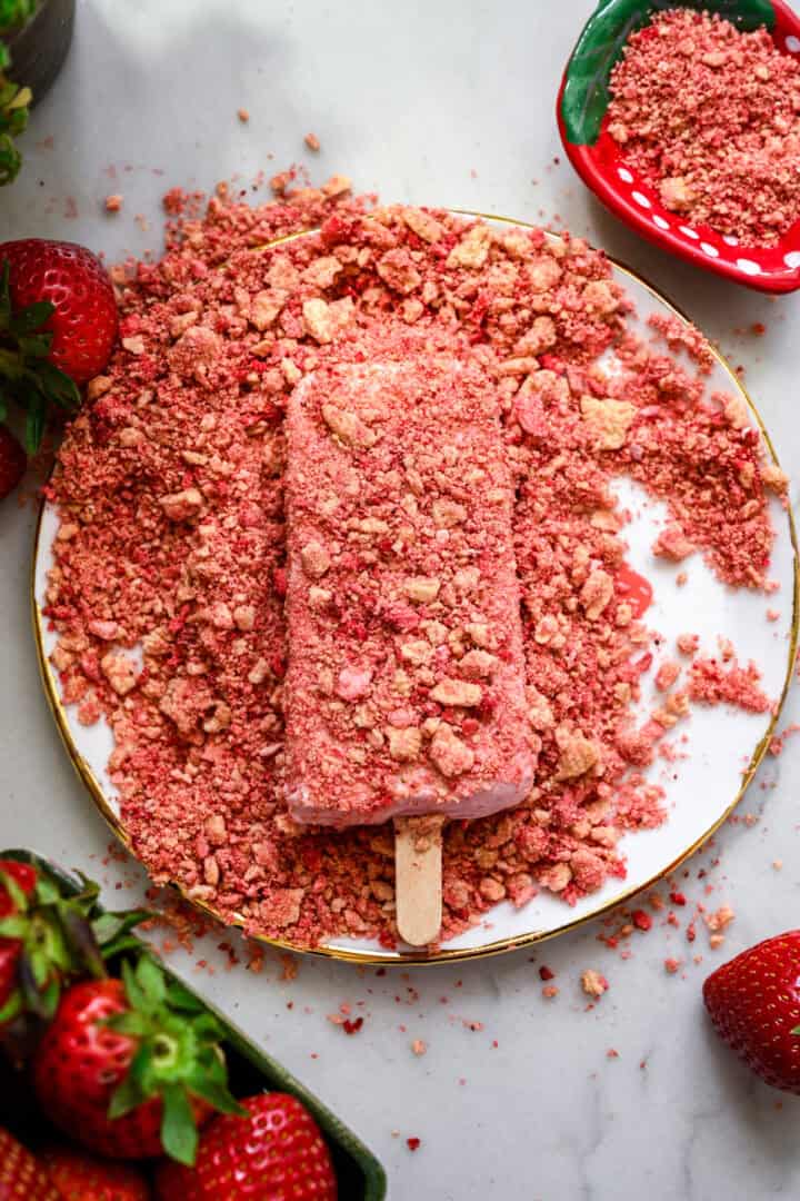After coating a popsicle in strawberry cookie coating.